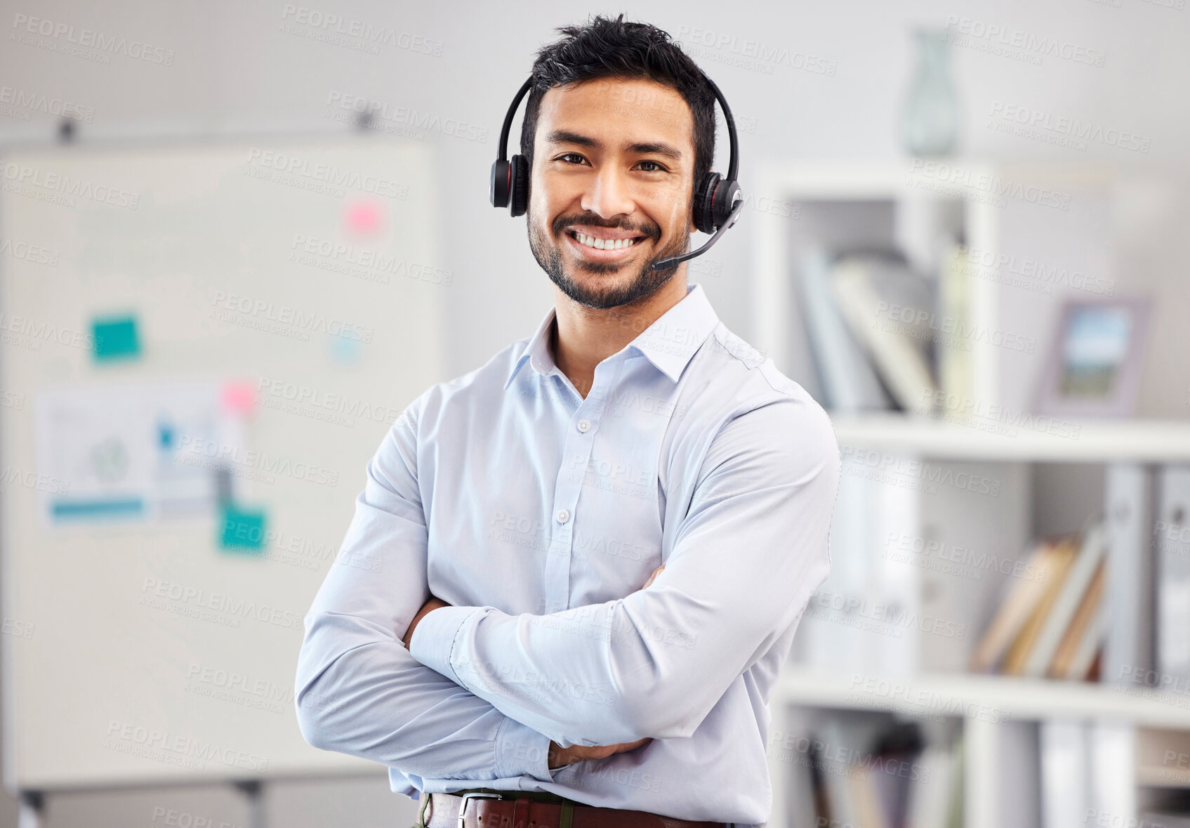 Buy stock photo Arms crossed, portrait or happy man in call center tech support consulting, speaking or talking in telemarketing. Communication, face or friendly consultant smiling in telecom sales with microphone