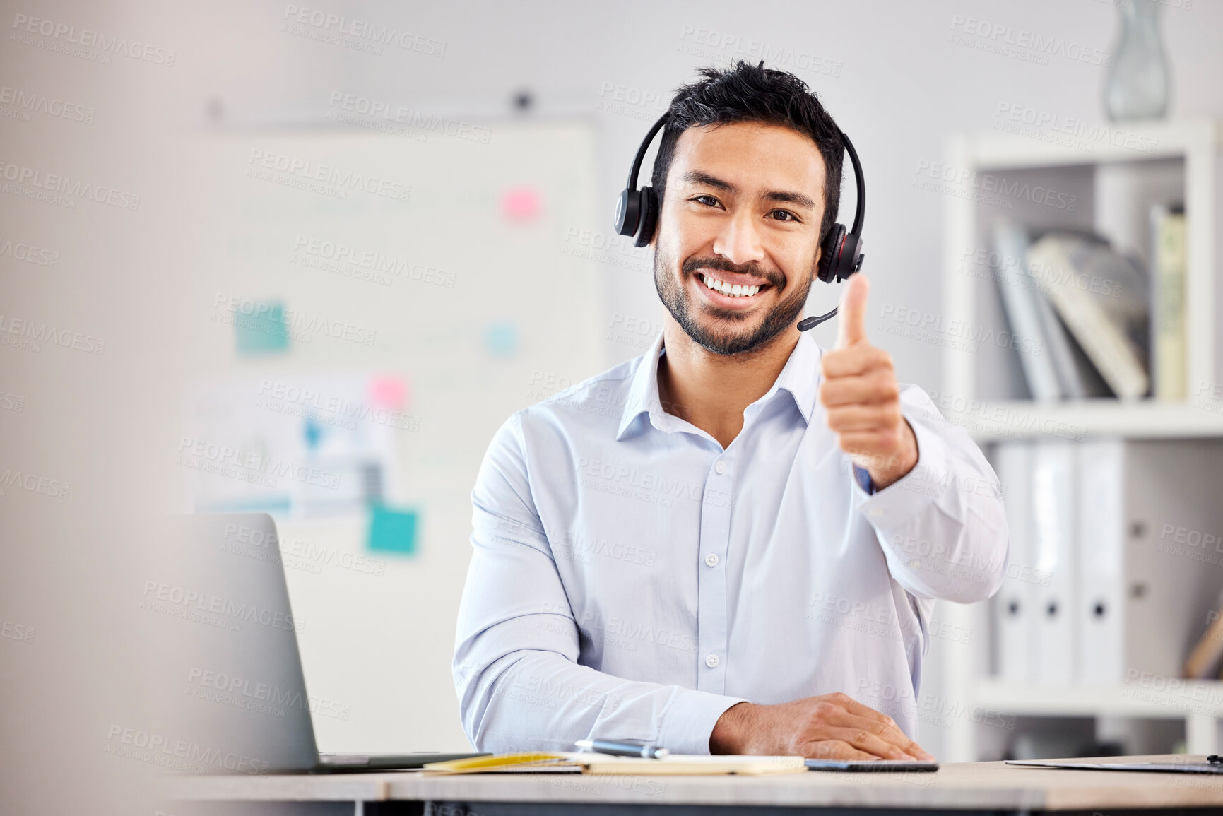 Buy stock photo Call center, portrait or happy man with thumbs up for agreement in customer services help desk. Smile, thumb up or Asian sales agent with like, success or yes hand sign in telecom for CRM success 