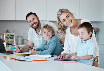 Buy stock photo Young happy caucasian family being creative and drawing together at home. Loving parents helping their little children with homework. Carefree siblings smiling having fun with their mom and dad