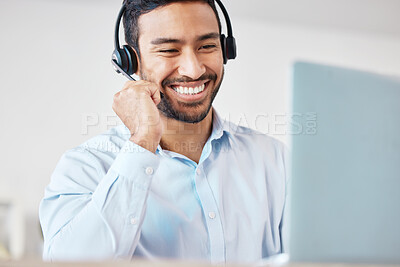 Buy stock photo Smiling mixed race male call centre agent smiling while wearing a wireless headset. Young man working as a customer service representative and consulting clients online while using a laptop