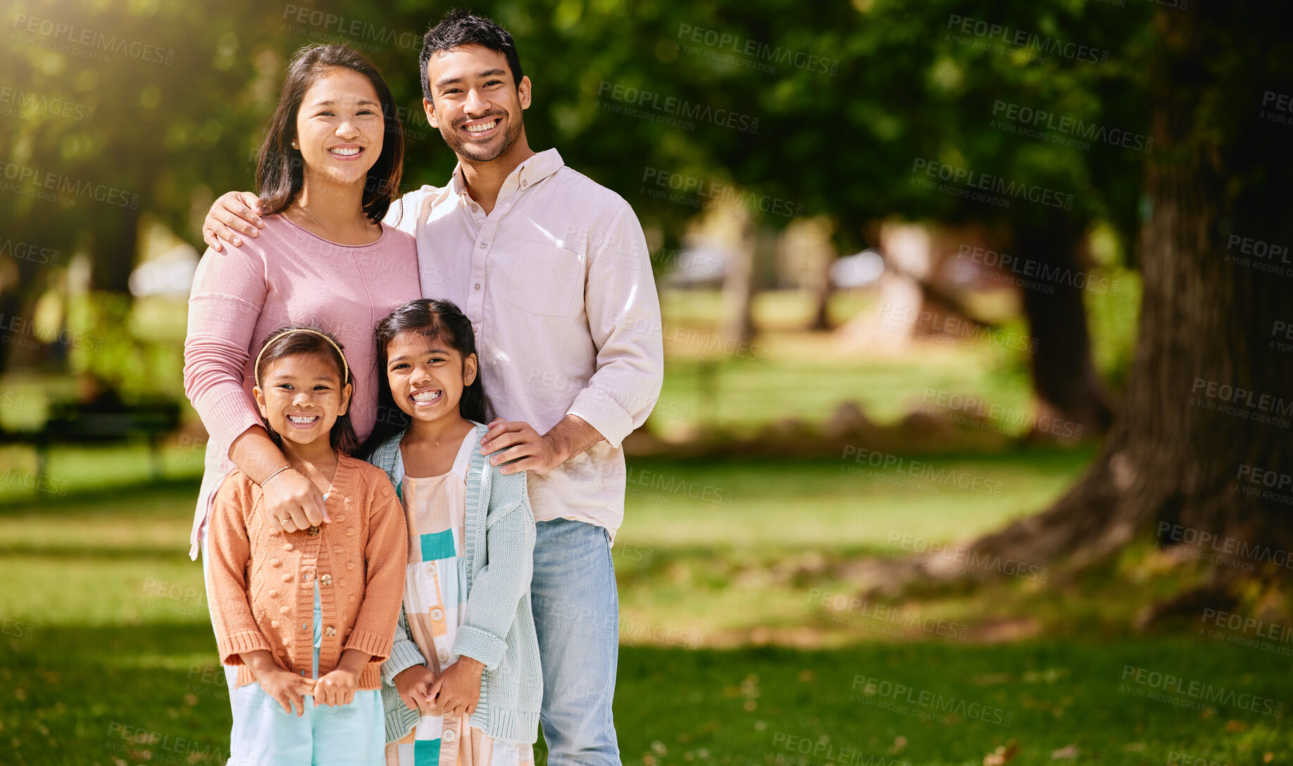 Buy stock photo Portrait of happy family, park and parents with kids, mockup and bonding time in nature together with smile. Mother, father and children on grass field for fun outdoor adventure in summer garden.