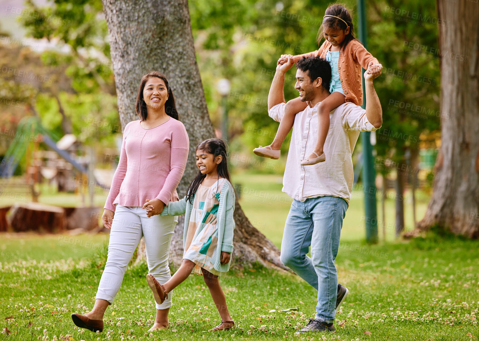 Buy stock photo Walking, piggyback and happy family in a park, talking and bonding with love, smile and fun in nature. Children, parents and conversation in forest together on weekend, cheerful and enjoying freedom