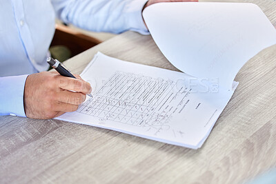 Patent filling medical form. Closeup of a business man writing on a healthcare document in an office. A doctor doing research on a patient’s medical history