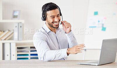 Happy businessman working in a call center. Customer service rep helping on a call. Sales agent speaking to client. IT assistant helping a customer. Telemarketing agent using headset to talk to client