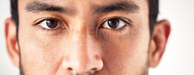 Closeup of an unknown asian man\'s face and eyes looking forward and into the camera. Zoom headshot of a mixed race man staring and watching in front. Healthy eyecare for clear optics and vision