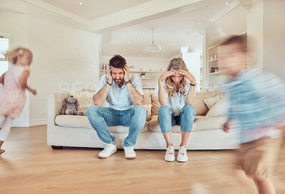 Buy stock photo Parents, headache and children running in living room, noise or depression. Stress, mother and father with kids run in lounge, tired and exhausted, burnout or migraine, frustrated and fatigue on sofa