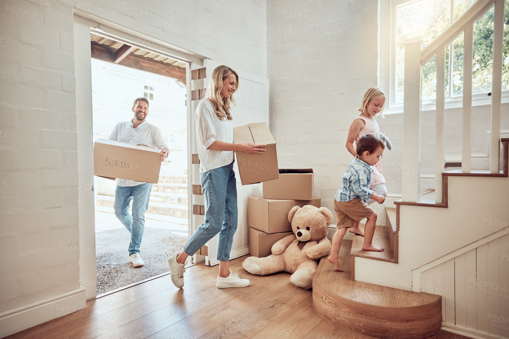 Buy stock photo Children, new home or parents moving boxes in real estate property investment or rental apartment. Mother helping, father or happy kids carrying or lifting a box in family house to move in together