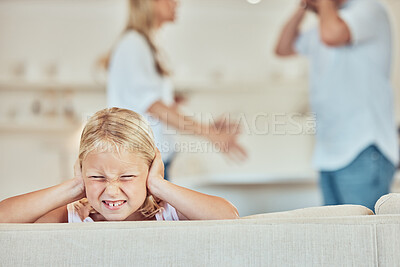 Buy stock photo Sad little girl covering her ears with parents fighting in the background. Depressed child, parents arguing at home. Couple in conflict around their daughter. Stressed parents might end in divorce