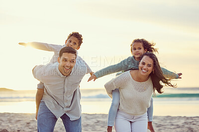 Buy stock photo Mother, father and kids piggyback on beach for family holiday, summer vacation and weekend. Nature, travel and portrait of happy mom, dad and child playing by ocean for bonding, fun and quality time