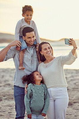 Buy stock photo Family, smile and beach selfie at sunset, bonding and having fun on sea vacation mockup. Photograph, ocean and mother, father and kids taking profile picture for social media, happy memory or summer.