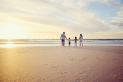Buy stock photo Sunset, travel and family holding hands on beach walking on holiday, summer vacation and weekend. Nature, mockup and mother, father and children by ocean for bonding, adventure and quality time