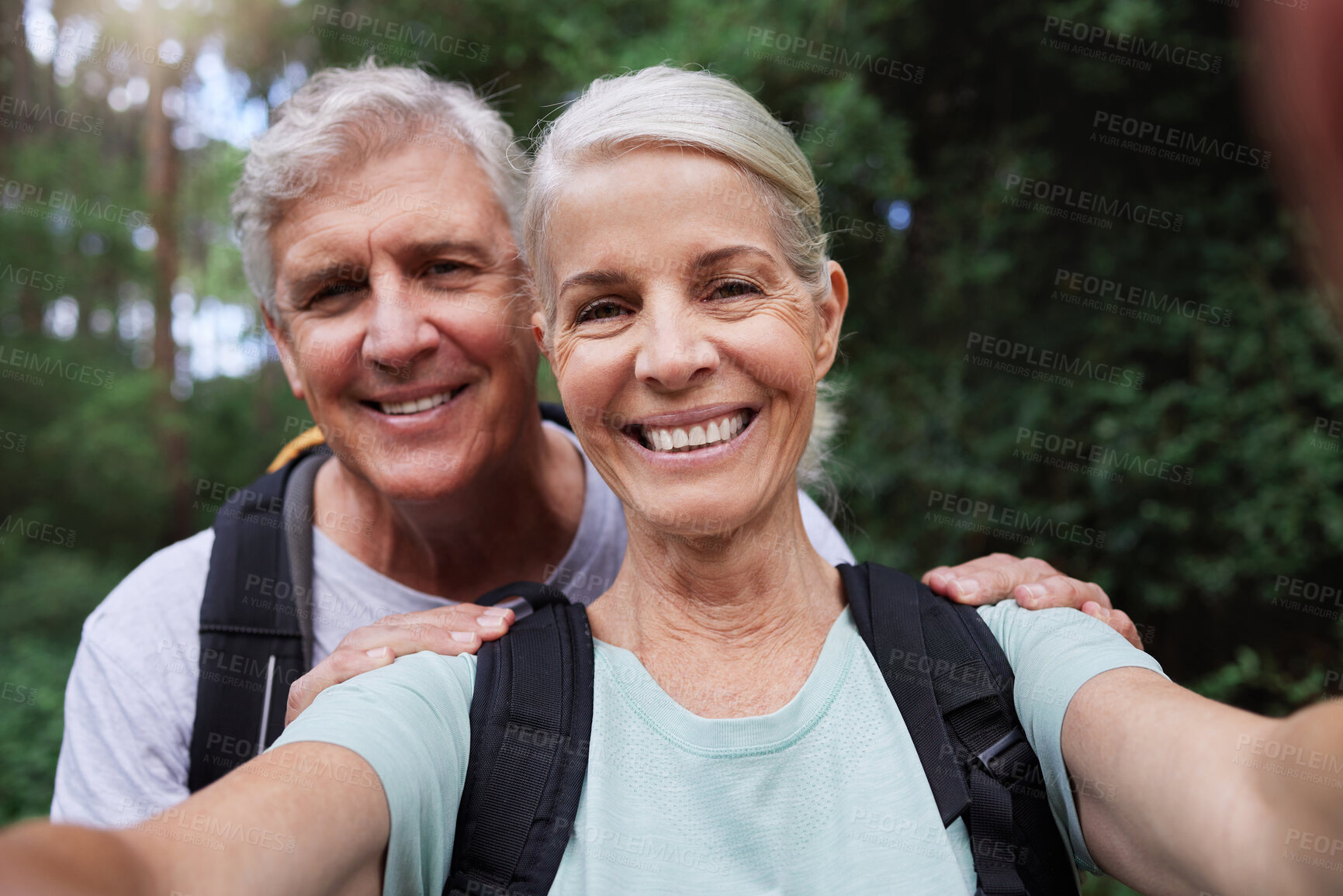 Buy stock photo Selfie, hiking and portrait of senior couple with smile on adventure in forest, woods and mountain for exercise. Fitness, retirement and happy elderly man and woman take picture trekking for wellness