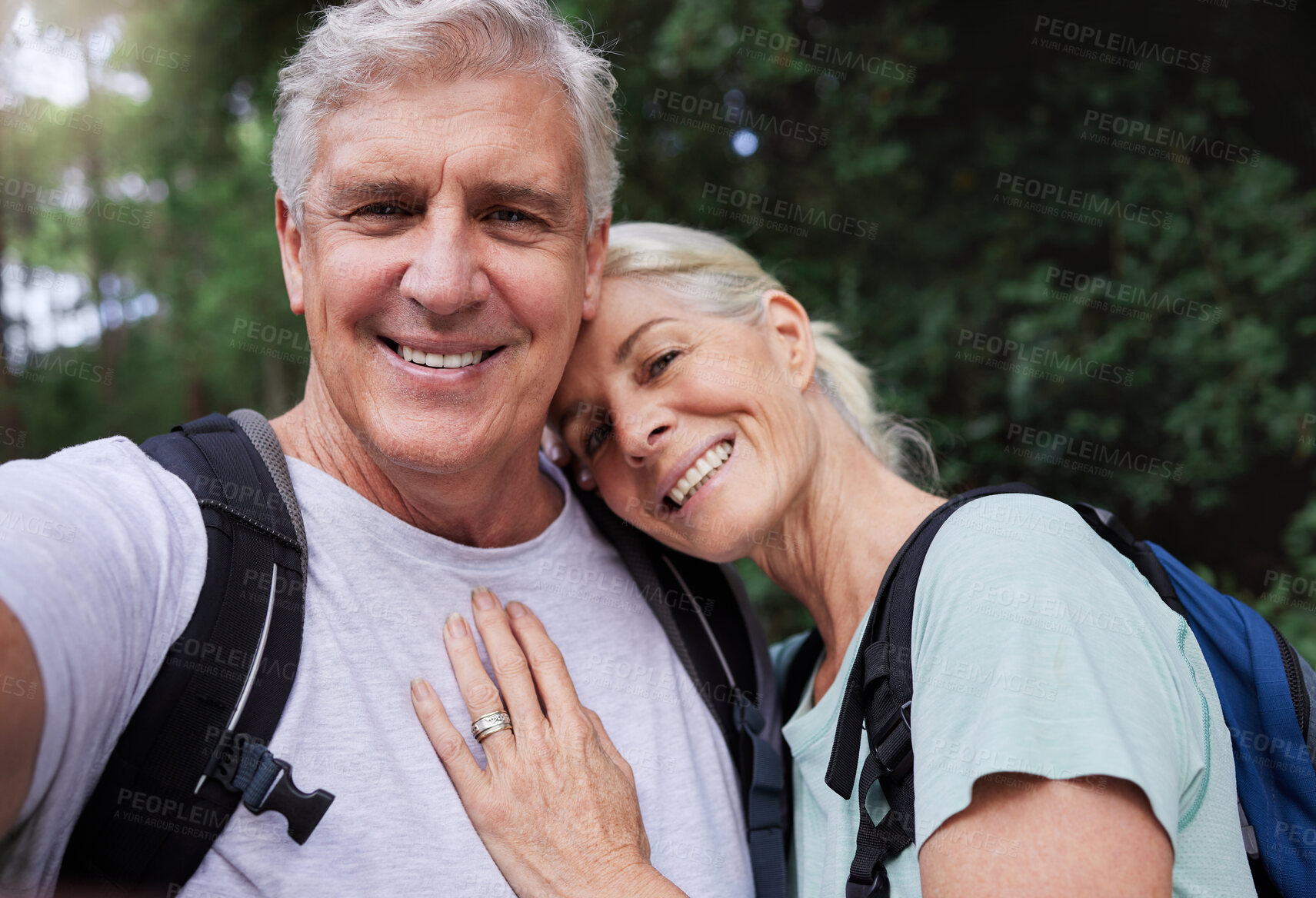 Buy stock photo Selfie portrait, hiking and mature couple hug in forest, fitness  love and outdoor health with happy blog update. Nature, travel and trekking face of mature people in woods with profile picture post