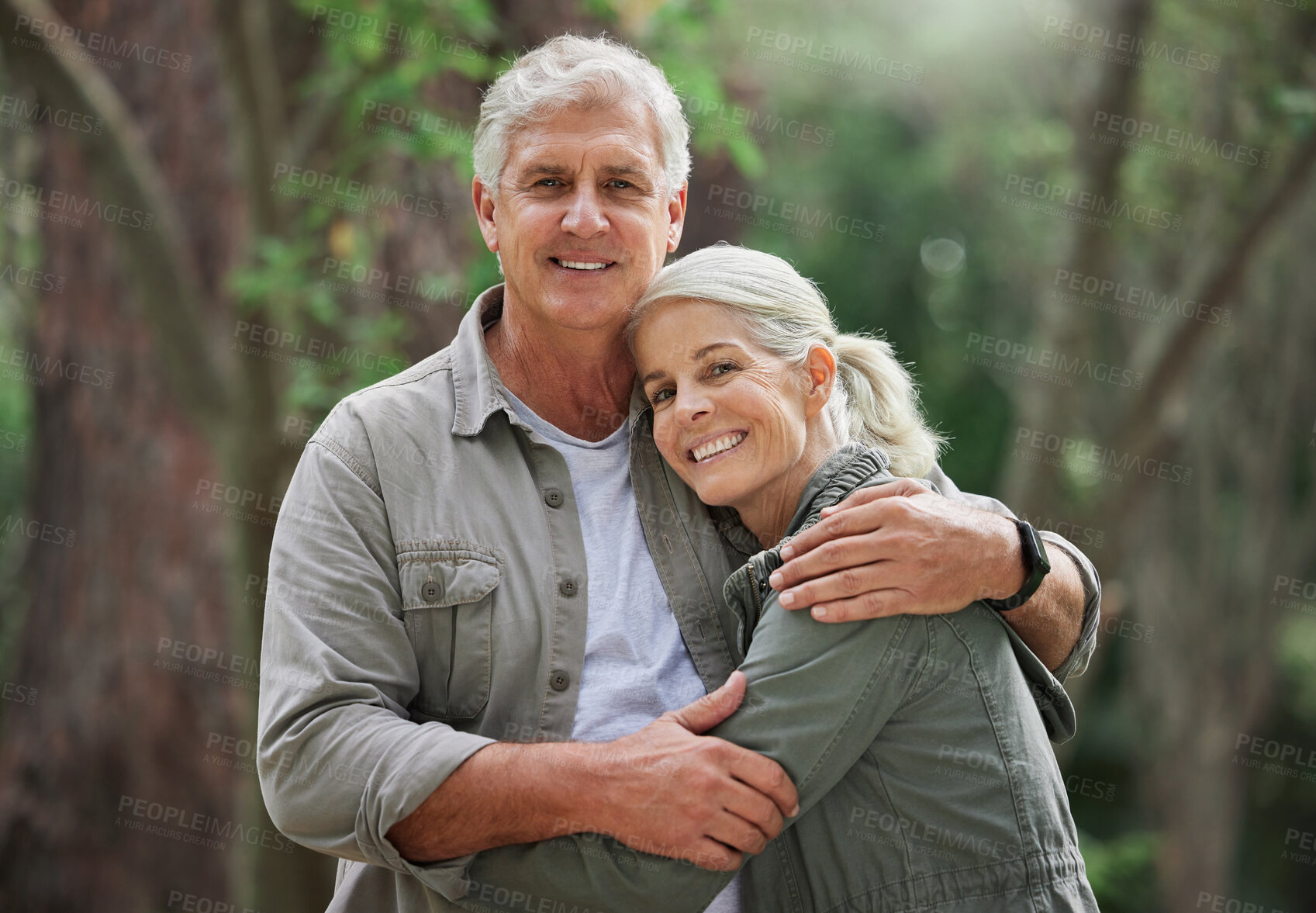 Buy stock photo Hug, hiking and portrait of senior couple with smile on adventure in forest, woods and mountain for exercise. Fitness, travel and happy elderly man and woman in retirement, holiday and relax on hike