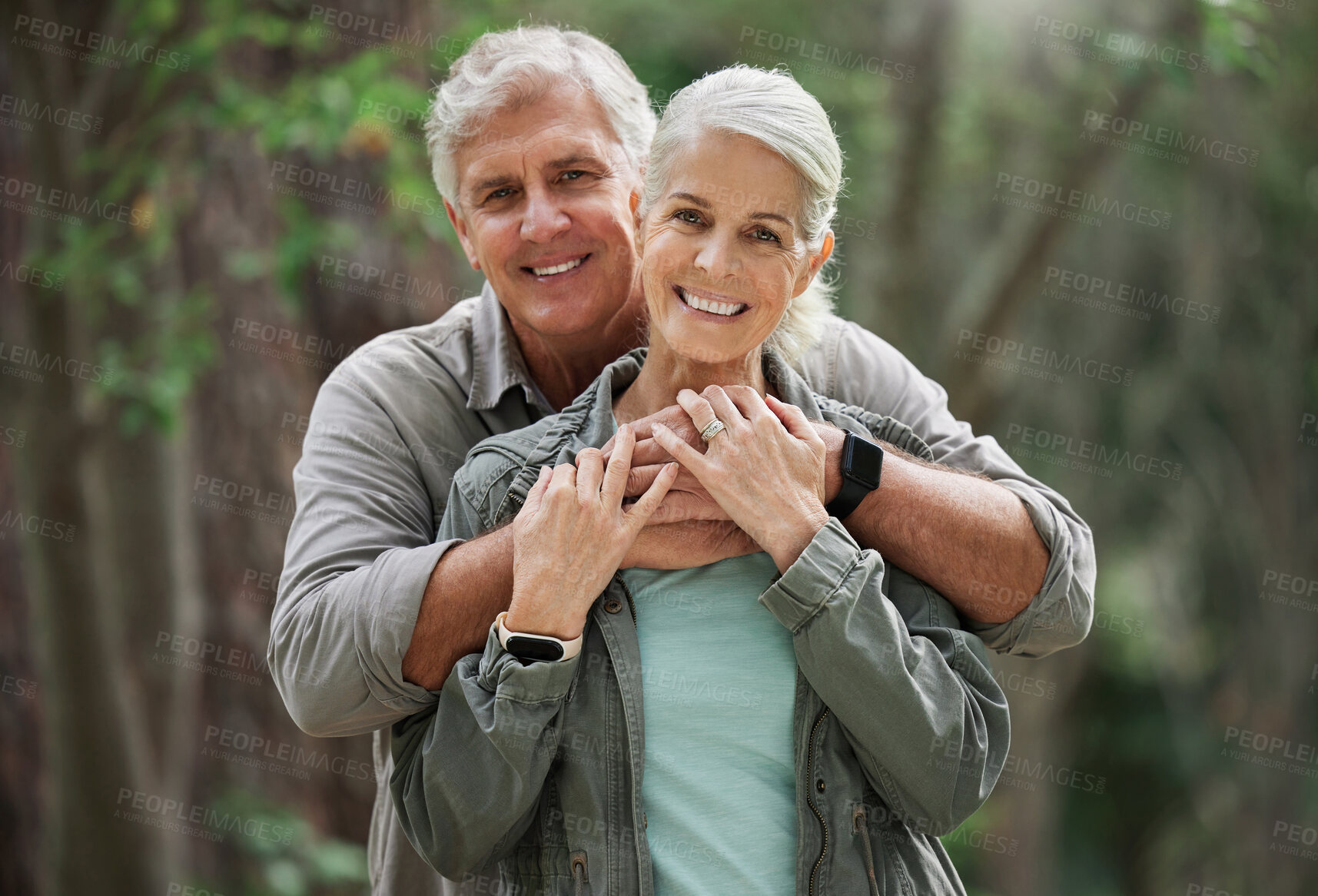 Buy stock photo Hug, hiking and portrait of senior couple with smile on adventure in forest, woods and mountain for exercise. Fitness, retirement and happy elderly man and woman trekking, walk and hike for wellness