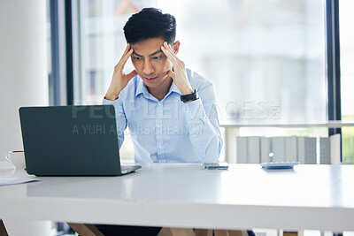 One young asian business man looking exhausted, tired and unmotivated while waiting on slow laptop connection error. Lazy man slacking and ignoring deadlines. Feeling burnout and stress in the workplace