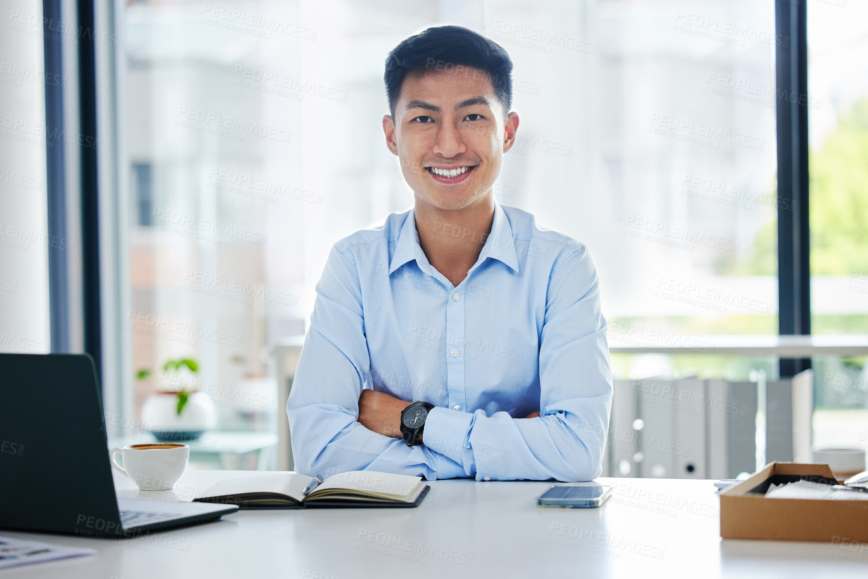 Buy stock photo Portrait, business and Asian man with arms crossed, laptop and confident consultant in a workplace, smile and career. Face, male person or employee with a pc, technology or notebook with professional