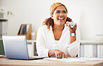 Young happy mixed race businesswoman on a call using a phone while going through a report and working on a laptop in an office at work. Hispanic female boss smiling while talking on a cellphone