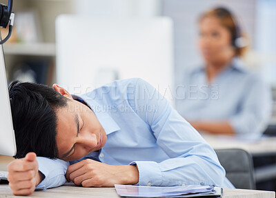 Buy stock photo Call center, burnout or tired man sleeping on table exhausted or overworked by deadlines in overtime. Resting, dreaming or lazy sales agent with stress or fatigue napping on relaxing break at desk