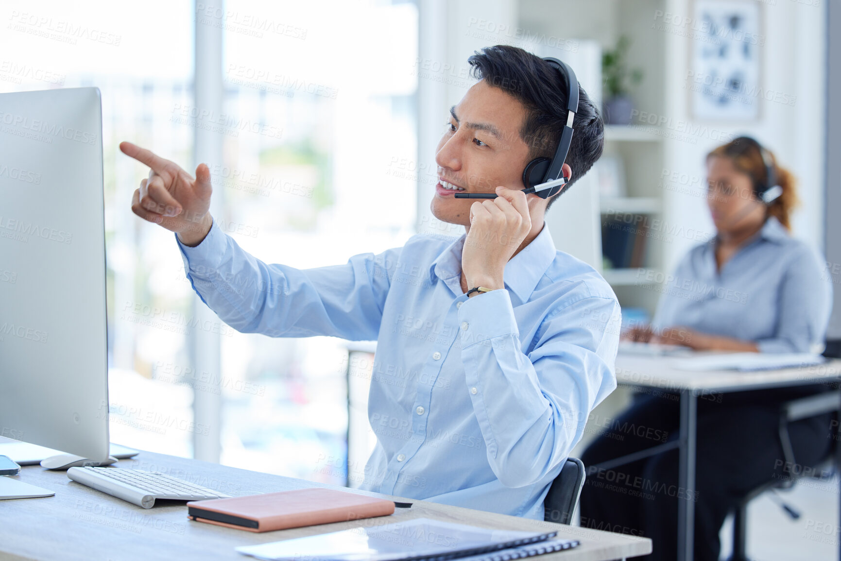 Buy stock photo Computer, call center and man talking on headset for telemarketing or sales account information. Asian person reading desktop for database, technical support or online consultation for user email