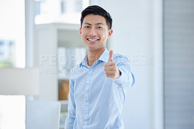 Portrait of one happy young asian businessman gesturing thumbs up for success and agreement in an office. Confident and smiling entrepreneur expressing good luck for winning and achievement. Showing trust and support