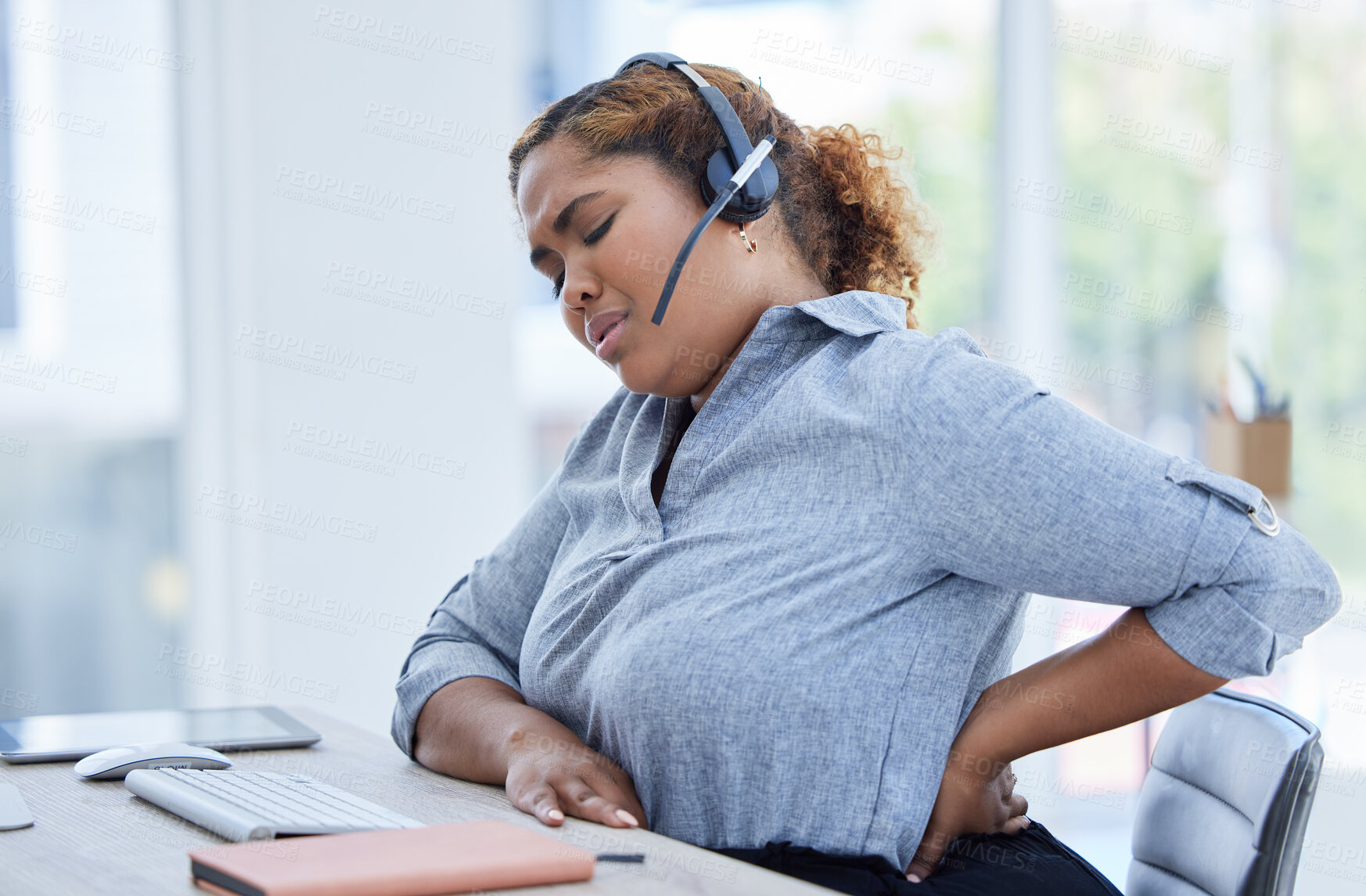 Buy stock photo Call center, back pain and woman consulting for customer service while suffering arthritis or inflammation in office. Spine, backache and female consultant with posture issue while working for crm