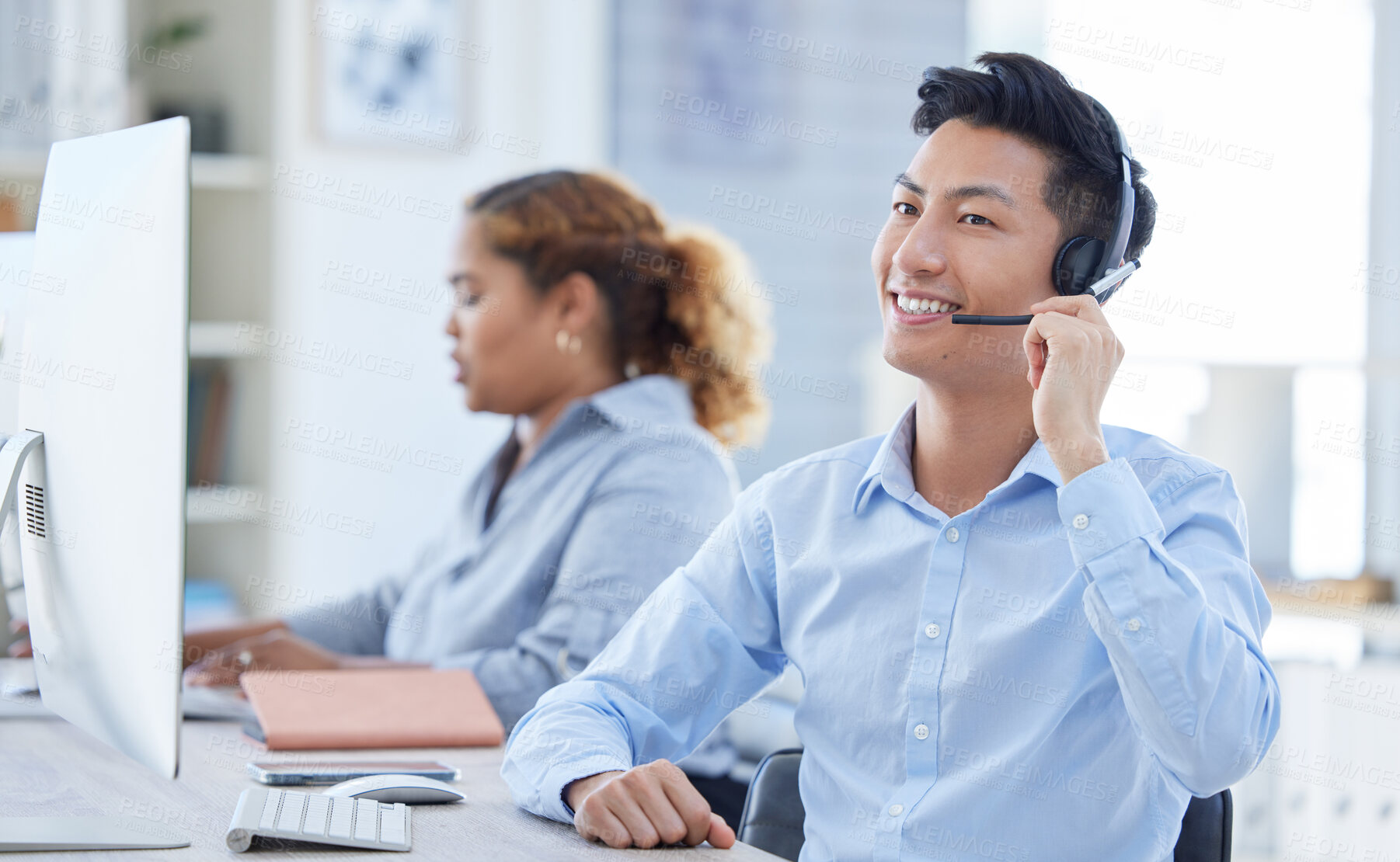 Buy stock photo Call center, smile and asian man in office for customer support, advice and friendly service. happy, telemarketing and male consultant online for help, support or crm, faq or contact us communication