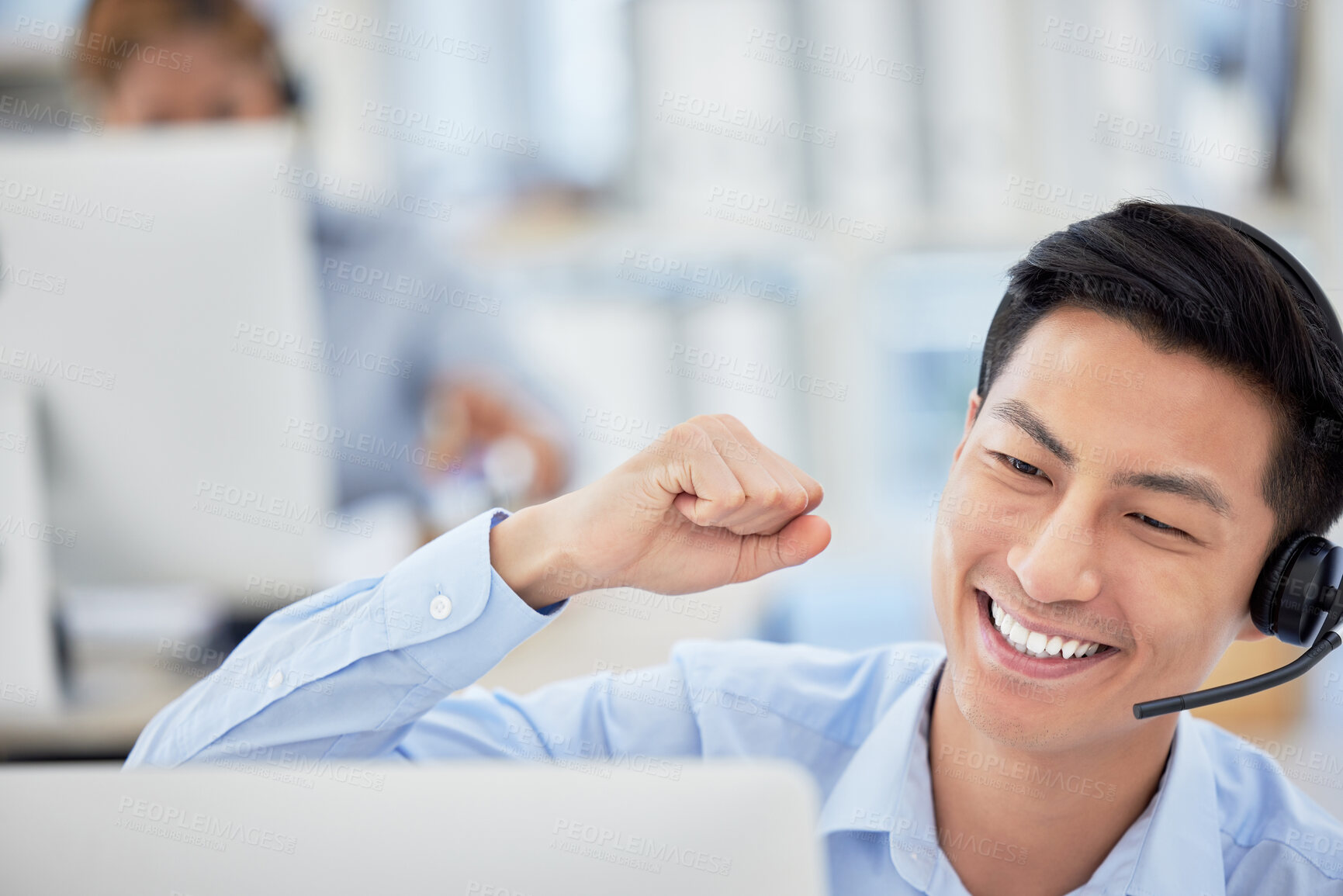 Buy stock photo Man, telemarketing and phone call celebrate happy for customer service, office work or company sale. Asian person, fist for achievement as communication employee for care, discussion at help desk