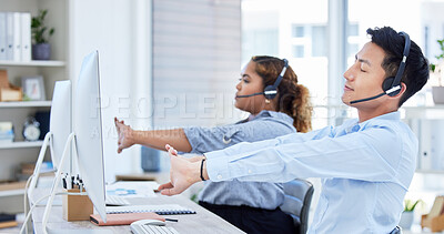 Some calls just make you question your choice in career. Shot of a young asian man and hispanic woman stretching while using a headset and computer in a modern office.