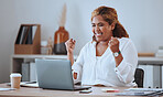 Happy and cheerful mixed race business woman cheering while working on a laptop in office. Confident hispanic female boss smiling while celebrating a victory or reading loan approval email 