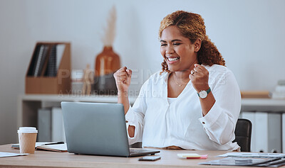 Happy and cheerful mixed race business woman cheering while working on a laptop in office. Confident hispanic female boss smiling while celebrating a victory or reading loan approval email