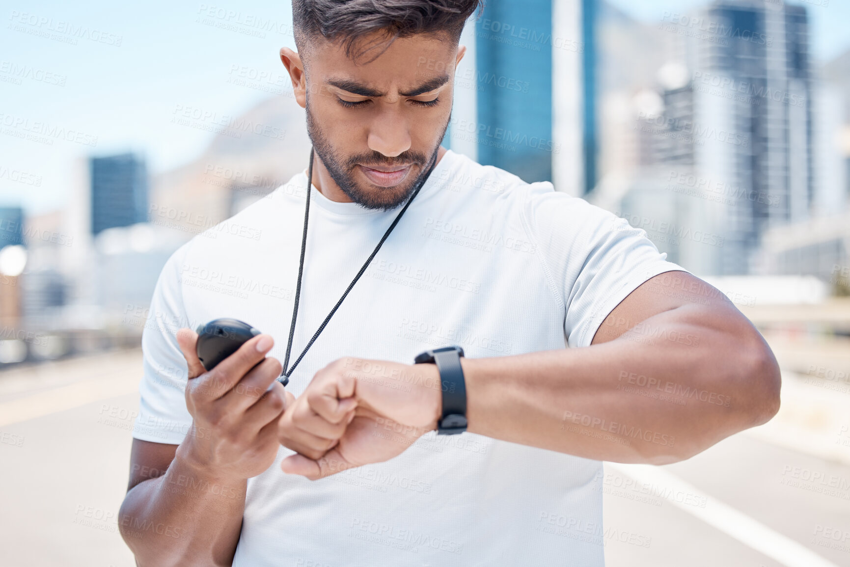 Buy stock photo Fitness, stopwatch and man in city for time, results and tracker for running, exercise and workout. Wellness, sports and male person check smart watch for marathon training, monitor and performance