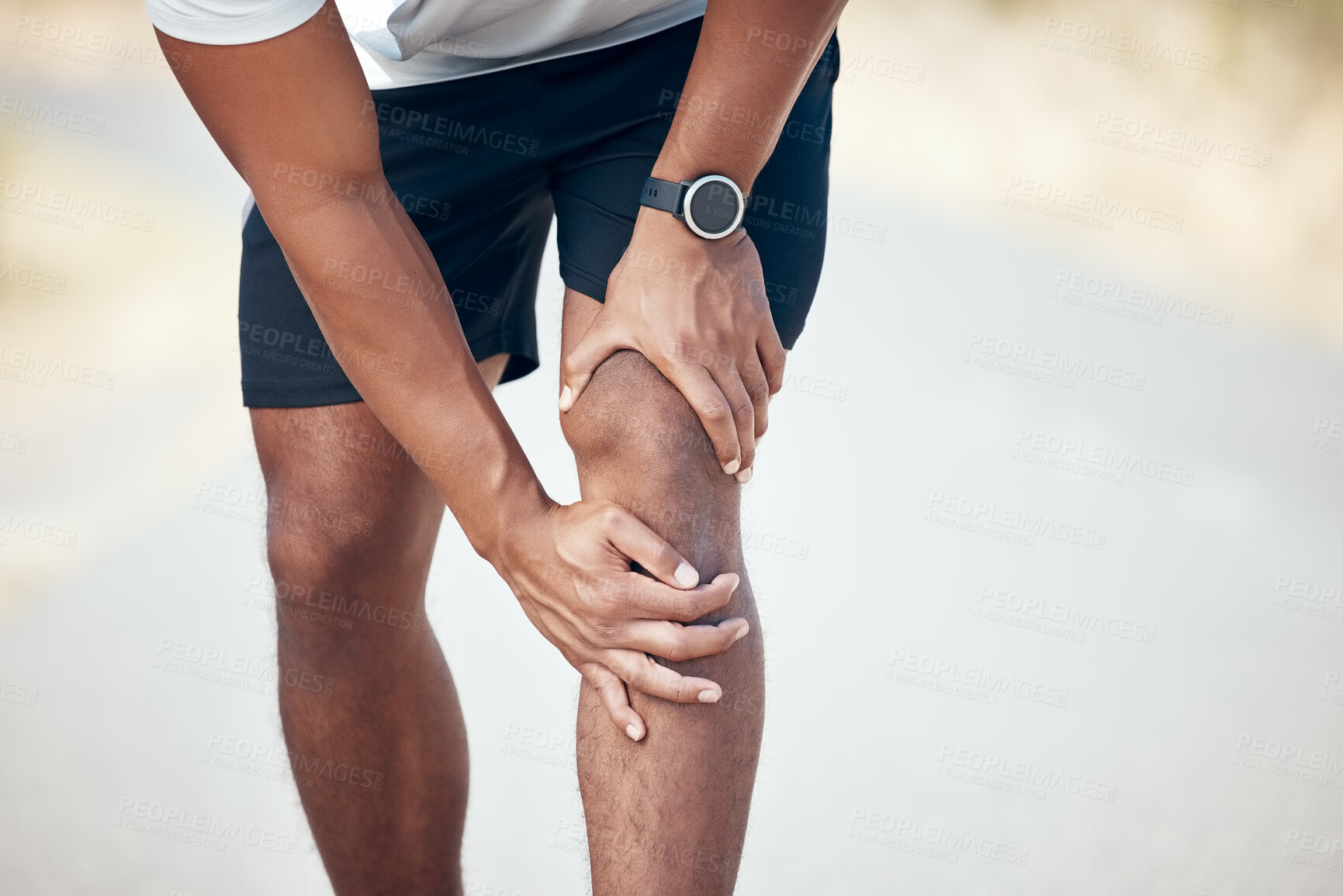 Buy stock photo Running, knee pain and closeup of man in city for inflammation, accident and emergency. Fitness, workout and training with legs of male runner in road for muscle ache, sports injury and first aid