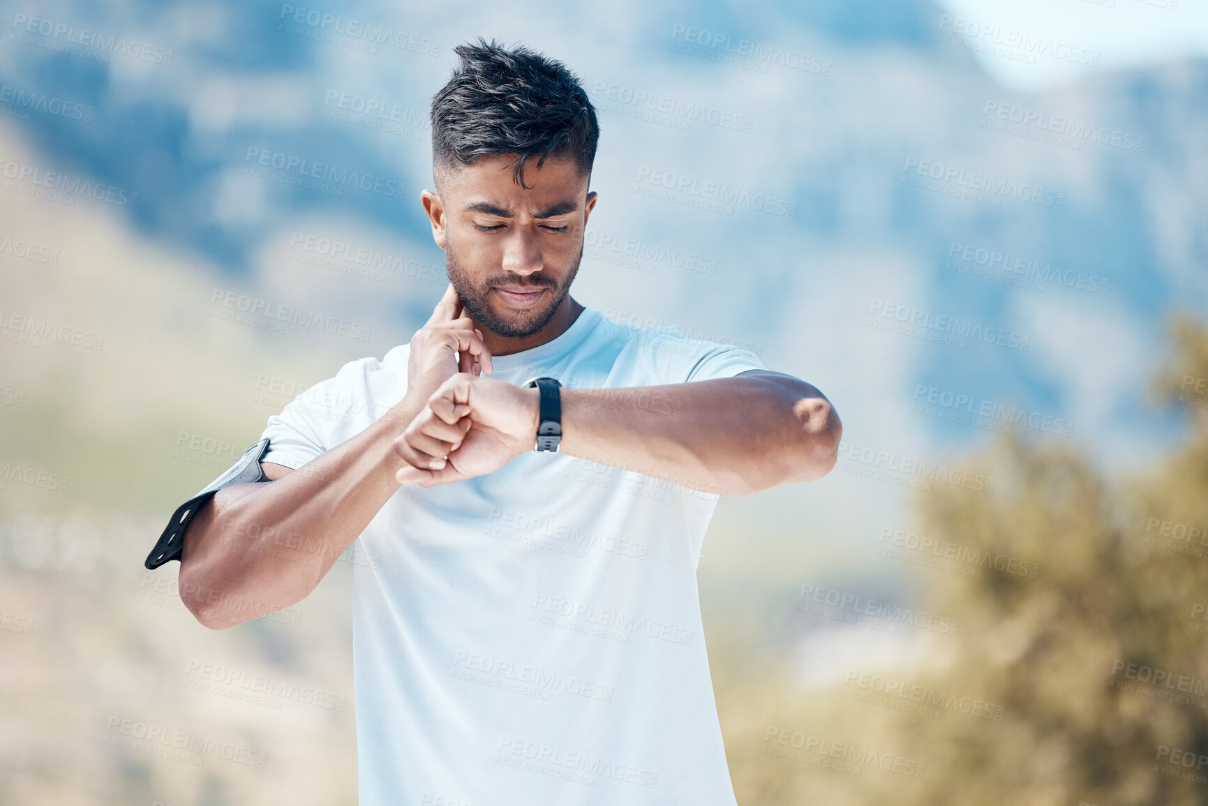 Buy stock photo Health, smartwatch and athlete training heart rate for outdoor sports, marathon or cardio strength with mountain exercise. Fitness, watch and young man or runner on a hike workout for wellness