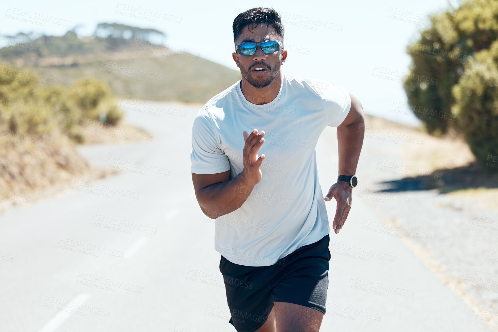 Buy stock photo Man, fitness and running in nature for workout, cardio exercise or training outdoors. Fit, active and sporty male person, athlete or runner exercising on mountain asphalt, road or street outside
