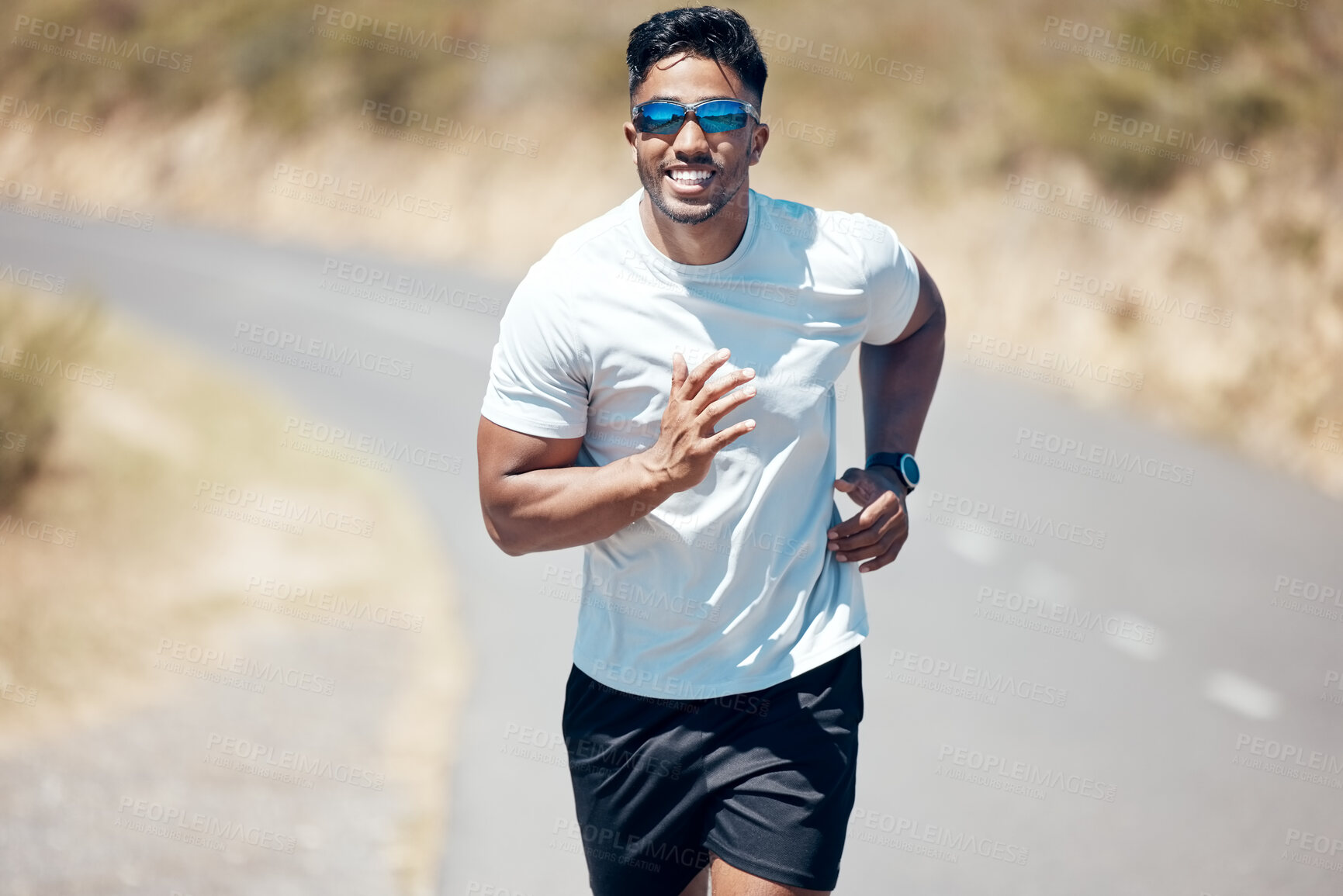 Buy stock photo Happy man, fitness and running on road for workout, cardio exercise or training in nature. Fit, active and sporty male person, athlete or runner exercising on mountain, asphalt or street run outdoors