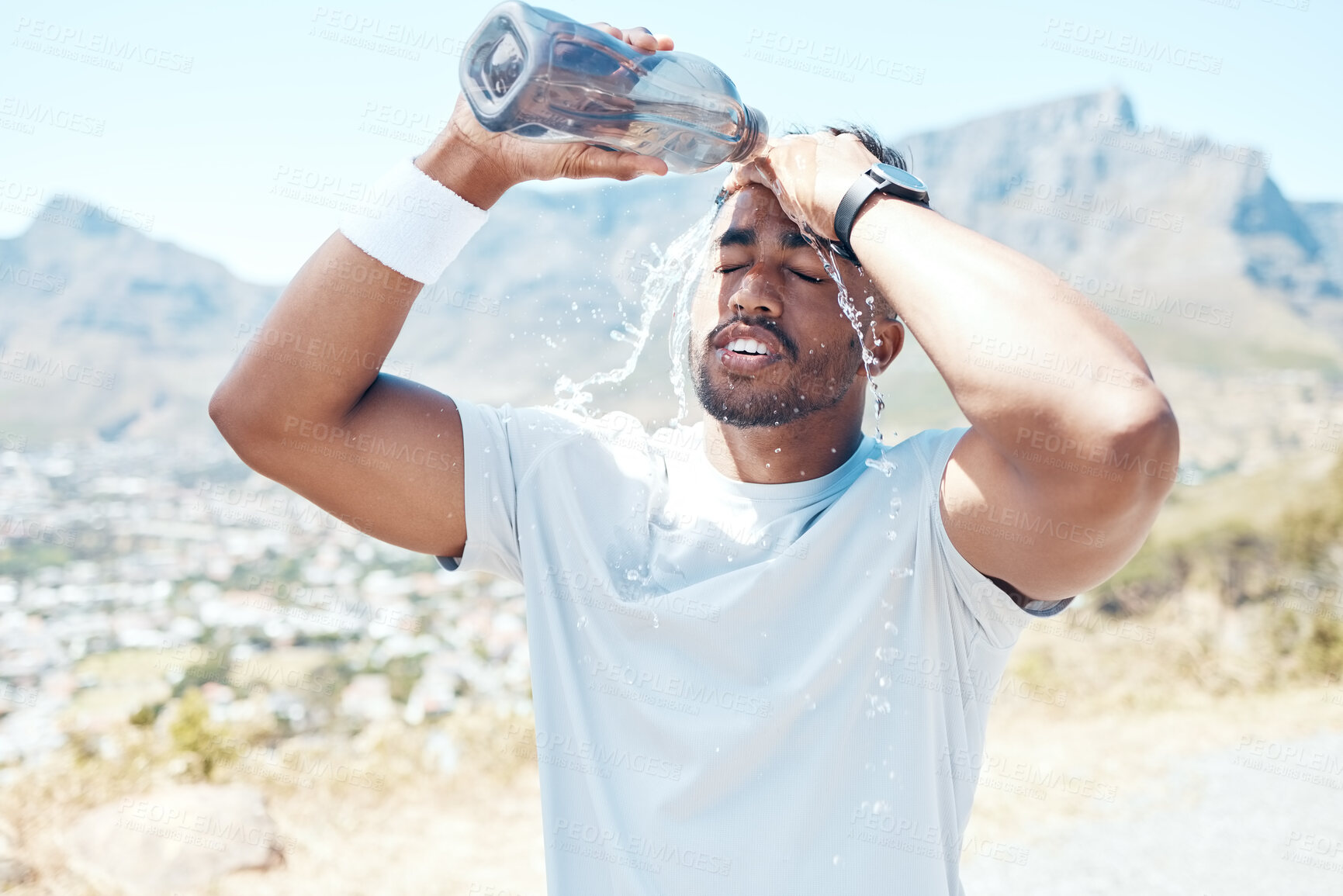 Buy stock photo Pour water, fitness and face of man on mountain for exercise, marathon training and running. Sports, nature and male person refresh with liquid for wellness, cardio workout and hydration to cool down