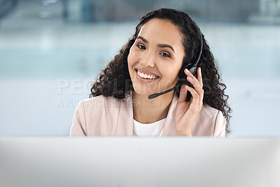 Businesswoman working in a customer service call center. Happy IT support agent. Customer service assistant making a call on her headset. Sales rep helping customers. Receptionist on a call