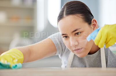 Buy stock photo Spray, table and cleaning with a woman housekeeper using disinfectant to remove bacteria in a home. Safety, surface and hygiene with a young female cleaner working in a house living room for service