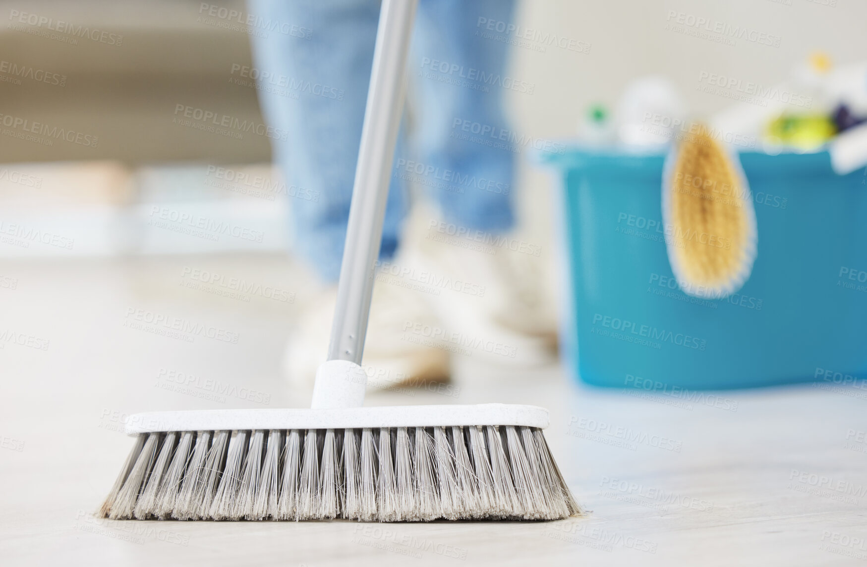 Buy stock photo Cleaning, broom and sweeping with a maid in the living room of a home for housework or chores. Floor, sweep and housekeeper with a cleaner in a house to tidy for hygiene during a spring clean closeup