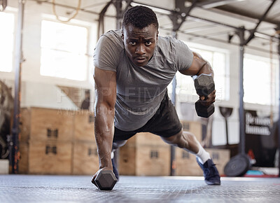 Buy stock photo Dumbbells, push up and exercise with a black man at gym for fitness, training workout and strong muscle. Serious African athlete or bodybuilder person with weights for power, focus and performance