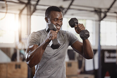 Buy stock photo Dumbbells, exercise and a happy black man at gym for fitness, training workout and strong muscle. African athlete or bodybuilder person with weights for power, biceps and focus at a wellness club 