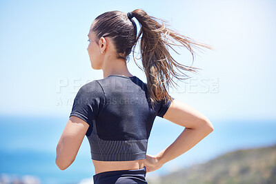 Rear view of Unknown fit active mixed race female running outside during a her daily exercise routine