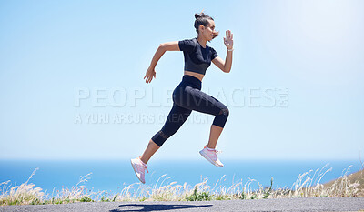 Buy stock photo Runner woman, street and jump in nature with speed, fitness and energy for training, wellness and healthy by sea. Girl, running and fast on road for self care, exercise and workout by ocean in summer