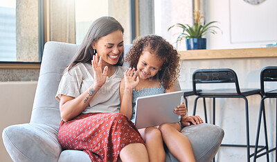 Buy stock photo Smiling hispanic mother and funny daughter on video call using digital tablet at home. Young mother and little girl using digital tablet while making video call and waving hello