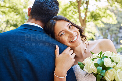 Buy stock photo Portrait of beautiful mixed race bride holding bouquet while standing with her groom and leaning on his shoulder in nature