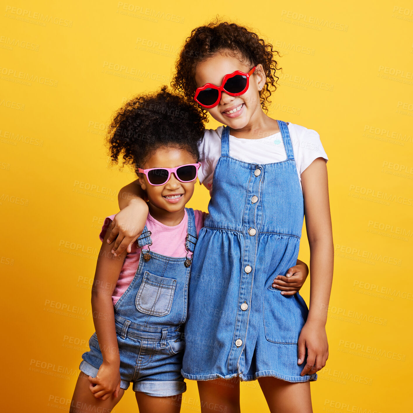 Buy stock photo Children, sunglasses and happy sisters in studio hug for love, care and support of family on yellow background. Cute young girl kids portrait together for happiness, carefree and fashion with a smile