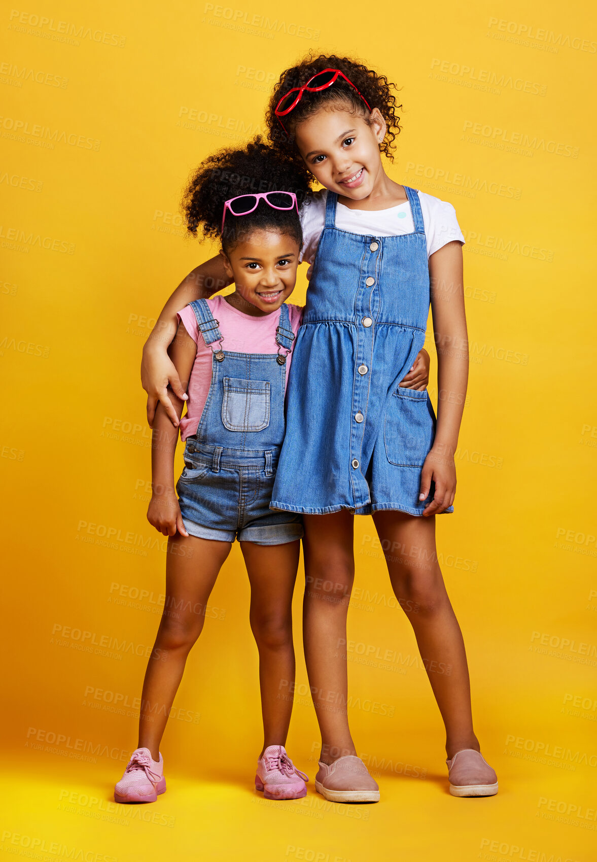 Buy stock photo Children, hug and happy portrait of sisters in studio with love, care and support on yellow background. Cute young girl kids smile together for happiness, carefree and positive attitude for family