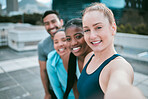 Portrait of a diverse group of happy sporty people taking selfies while exercising together outside. Cheerful motivated athletes excited and ready for training workout. Supportive friends taking photos for social media