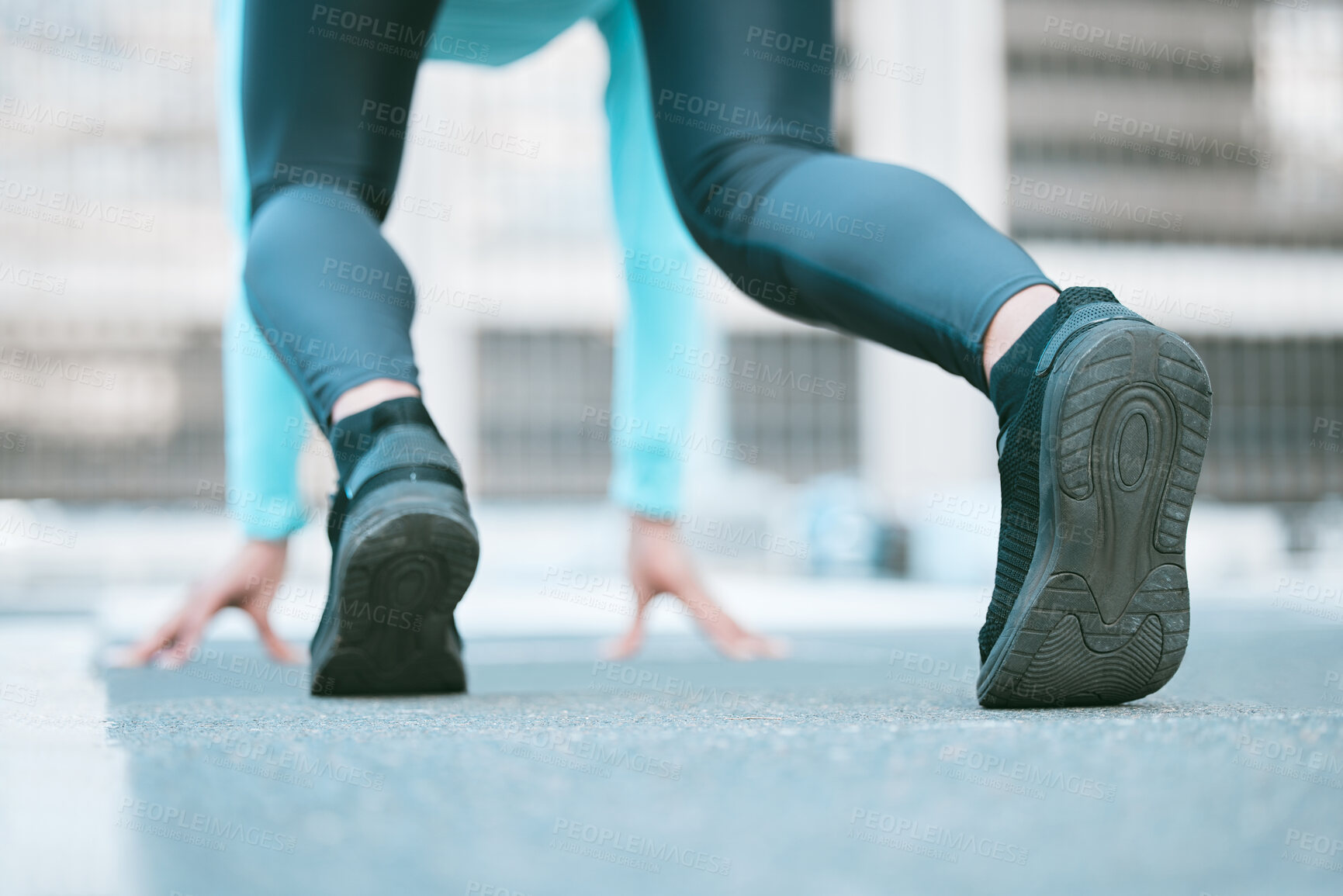 Buy stock photo Closeup of sole of shoes of one female athlete preparing to run a race in starting position while exercising outdoors. Sporty woman wearing footwear for sprint cardio training